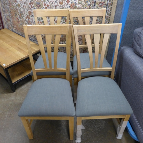 1457 - A set of four oak and dark grey upholstered dining chairs