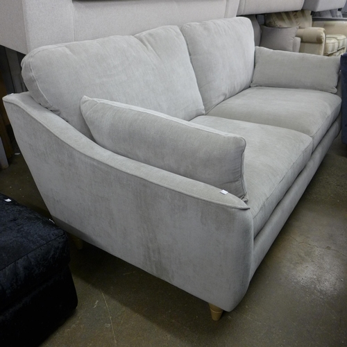 1473 - A dove grey upholstered three seater sofa