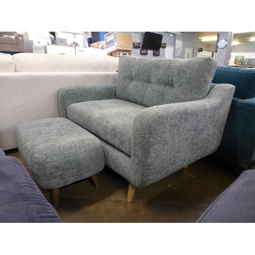 1534 - An aquamarine upholstered button back love seat with footstool