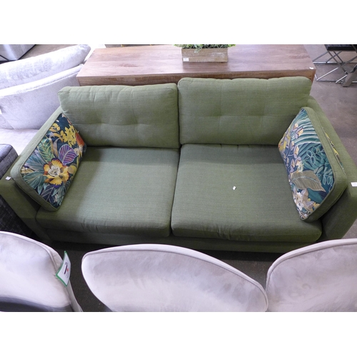 1541 - A forest green velvet 2.5 seater sofa with floral design scatter cushions