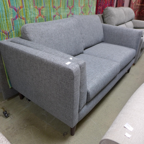 1585 - A stone grey upholstered three seater sofa