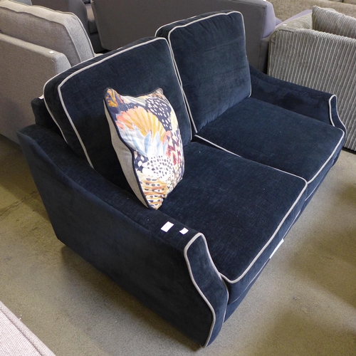 1596 - A midnight blue upholstered two seater sofa - no feet