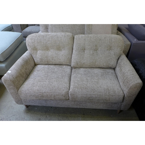 1611 - An oatmeal upholstered 2.5 seater sofa