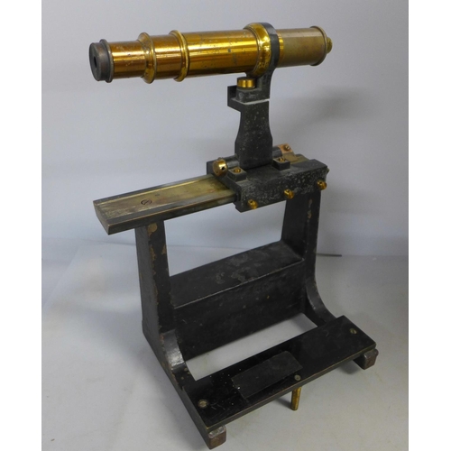 394 - A surveying tool/scope on stand, height 25cm