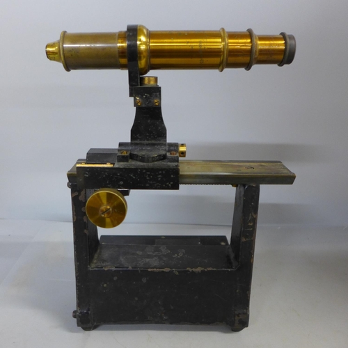 394 - A surveying tool/scope on stand, height 25cm