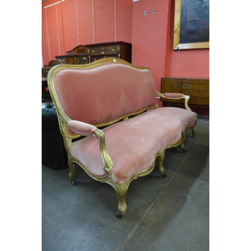 103 - A 19th Century French giltwood and pink fabric upholstered settee