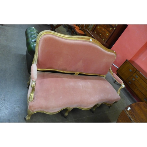 103 - A 19th Century French giltwood and pink fabric upholstered settee