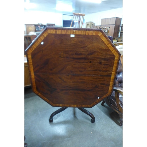 108 - A George IV mahogany octagonal tilt centre table