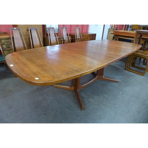 11 - A Danish Gudme Mobelfabrik teak extending dining table