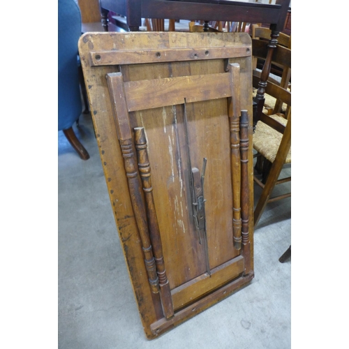 187 - An early 20th Century beech folding lady's sewing table with yard stick top