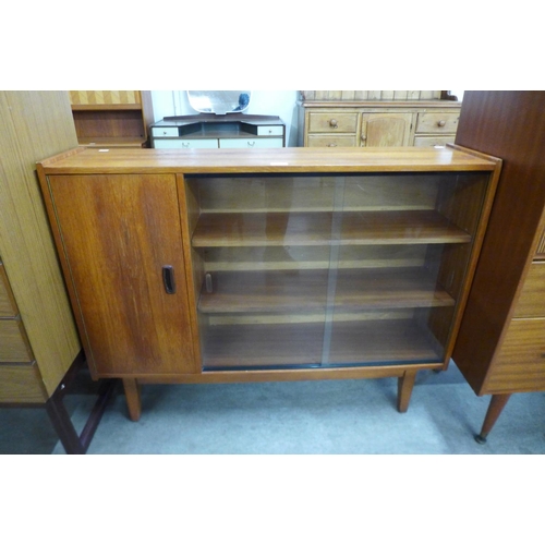 21 - A teak bookcase