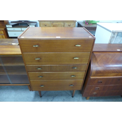 22 - A teak chest of drawers