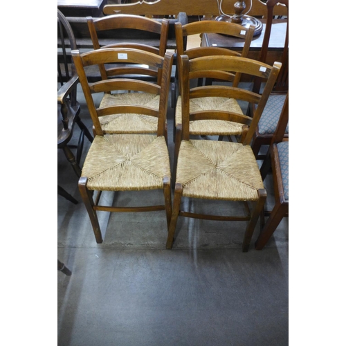 225 - A set of four French provincial beech chairs