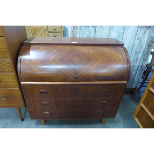 23 - A Swedish SMI teak cylinder bureau, designed by Egon Ostergaard