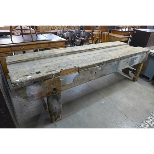 253 - A large industrial pine work bench and one other