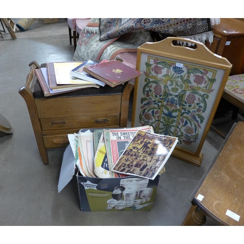 284 - An oak piano stool, an oak firescreen and assorted sheet music