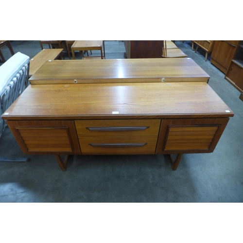 33 - A teak and afromosia sideboard