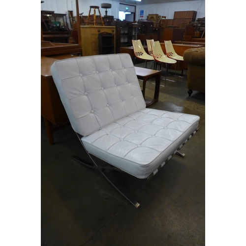 35 - A Barcelona style white leather and chrome chair