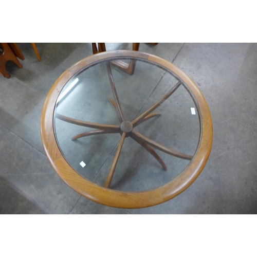 36 - A G-Plan Astro teak and glass topped circular spider coffee table