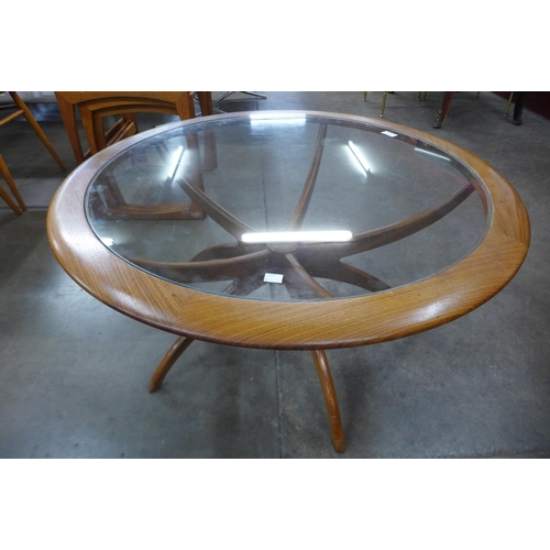 36 - A G-Plan Astro teak and glass topped circular spider coffee table