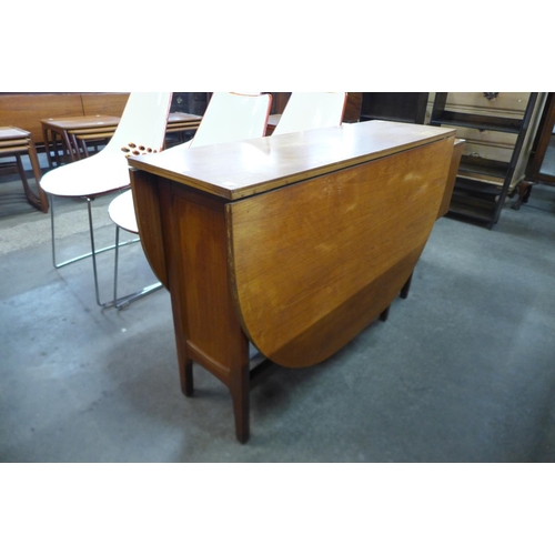 46 - A teak drop leaf table