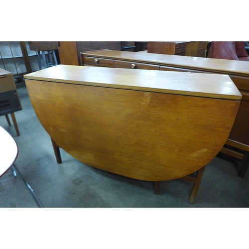 46 - A teak drop leaf table