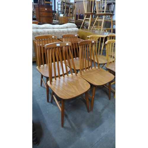 57 - A set of four beech kitchen chairs