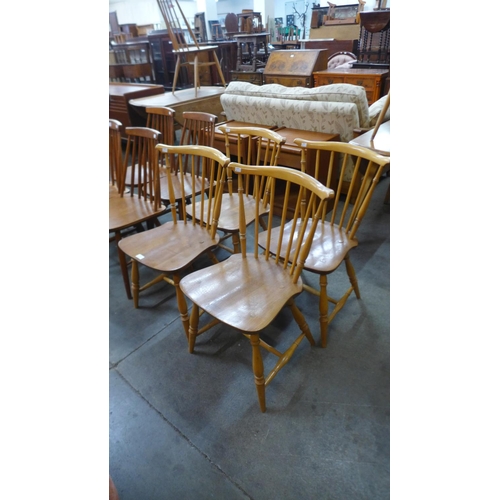 58 - A set of four Ercol Blonde elm and beech chairs