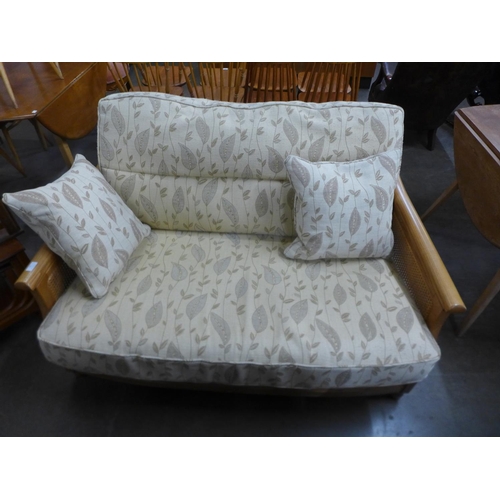 71 - An Ercol Blonde ash settee