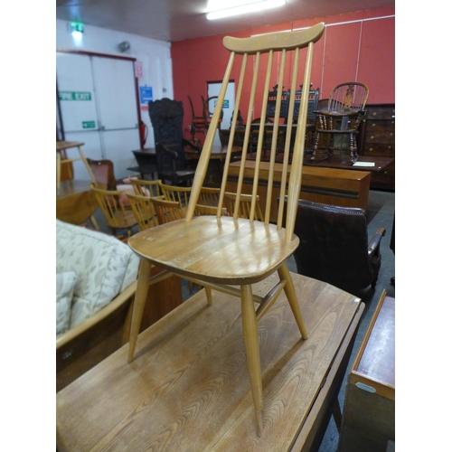 72 - An Ercol Blonde elm and beech drop-leaf table and a Goldsmith chair