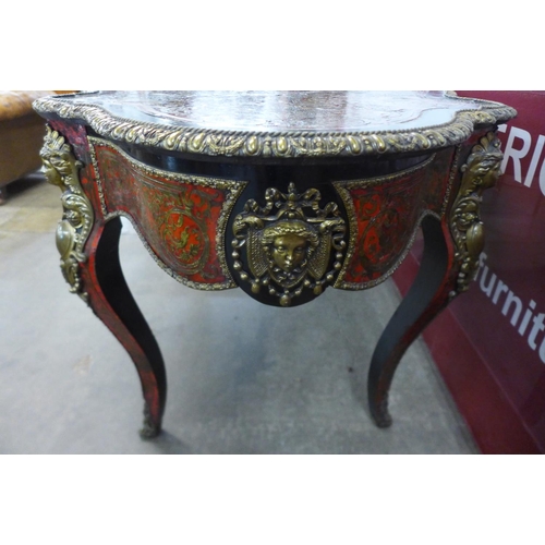 90 - A 19th Century French red Boulle, ebonised and gilt mounted serpentine single drawer centre table, 7... 