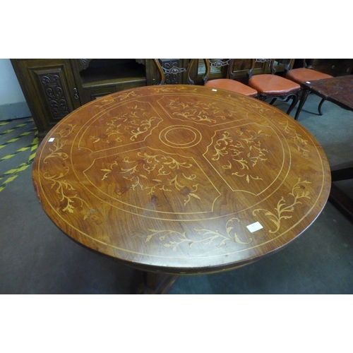 97 - A French style marquetry inlaid hardwood circular centre table