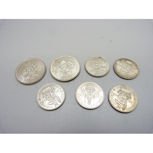 1021 - Seven coins; two 1944 shillings and five one shilling 1943, 1944, 2x 1945 and 1946