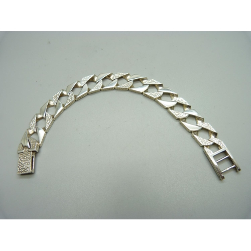 1024 - A gentleman's hallmarked silver curb bracelet, 53.8g, 21.5cm