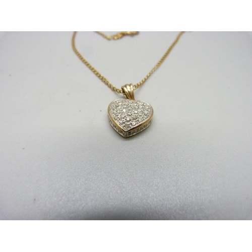 1036 - A 9ct gold and diamond pendant and chain, 0.5ct diamond weight, 5.1g