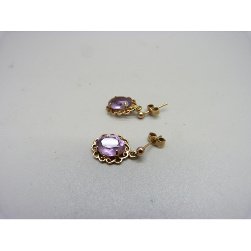 1037 - A pair of 9ct gold and amethyst earrings, 3g