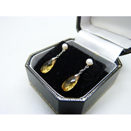 1041 - A pair of 9ct white gold, pearl and smoky quartz earrings