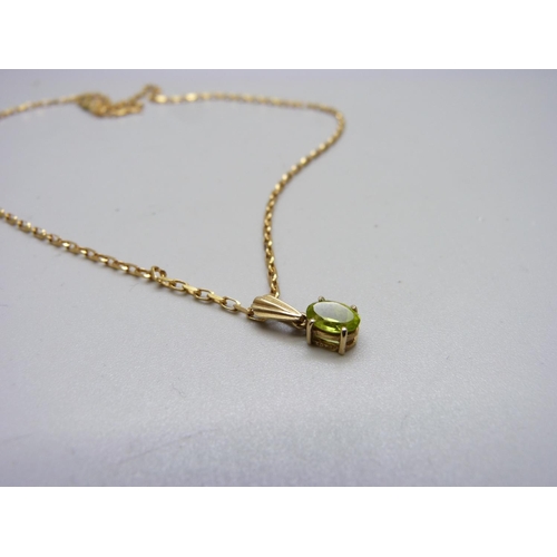 1045 - A 9ct gold and peridot and chain, 3.7g