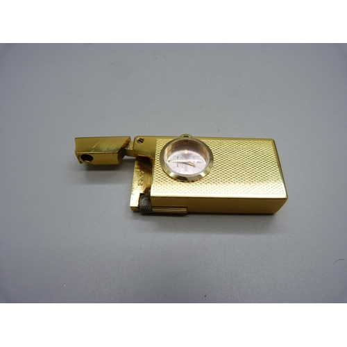 1098 - A Foska Swiss cigarette lighter, watch glass loose