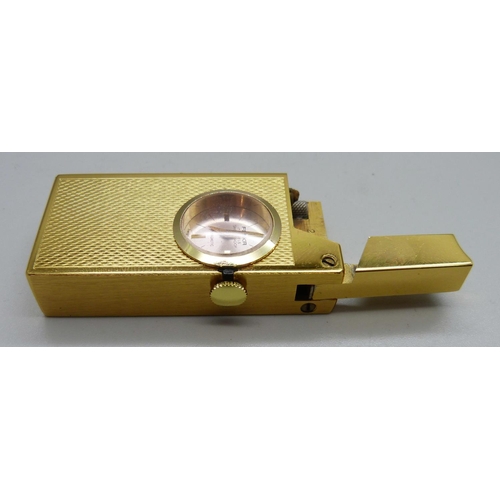 1098 - A Foska Swiss cigarette lighter, watch glass loose