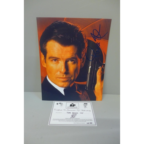 614 - A signed photograph of Pierce Brosnan, with coa