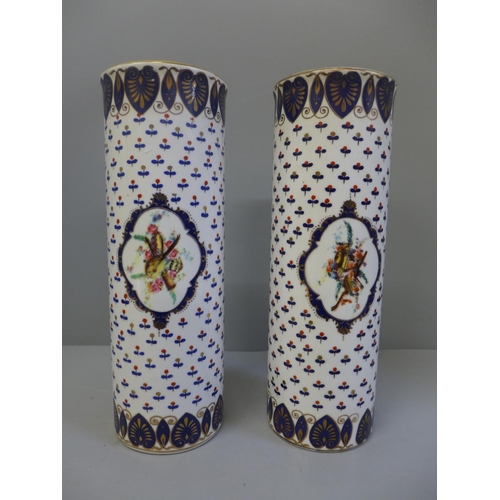 617 - A pair of cylindrical vases, 24cm