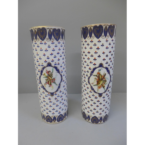 617 - A pair of cylindrical vases, 24cm