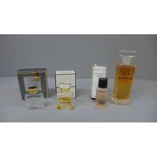 A bottle of Chanel No. 5 Elixir Sensuel perfume, revitalising lotion, one empty  bottle and a miniat