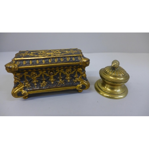 635 - An oblong ormolu trinket box with interior velvet lining and brass inkwell with mouse finial