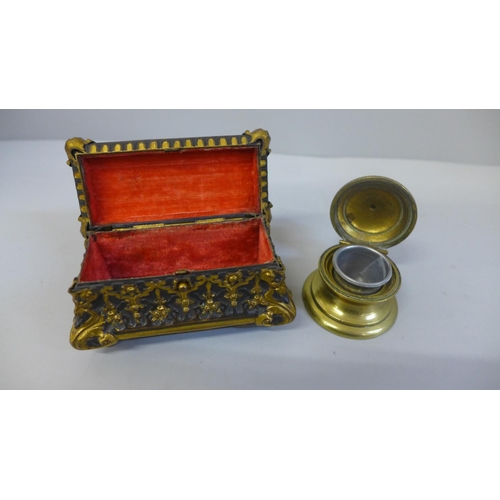 635 - An oblong ormolu trinket box with interior velvet lining and brass inkwell with mouse finial