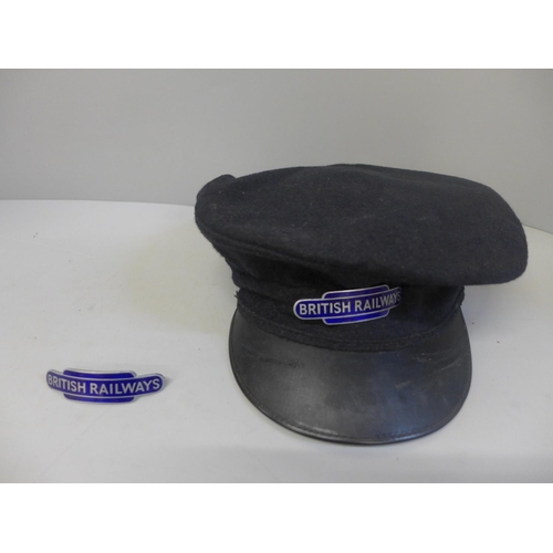 699 - A British Railways peaked cap and an enamel British Railways badge