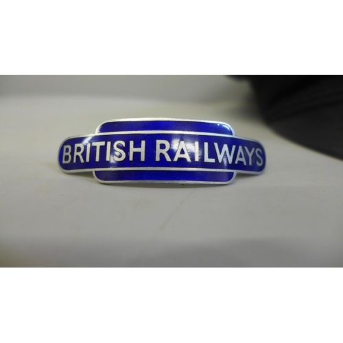 699 - A British Railways peaked cap and an enamel British Railways badge