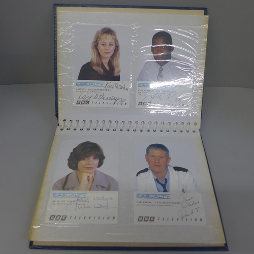 724 - An album of Casualty signed publicity cards (14), one duplicate