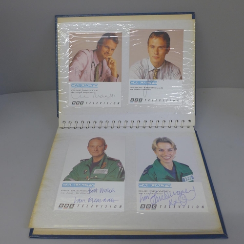 724 - An album of Casualty signed publicity cards (14), one duplicate